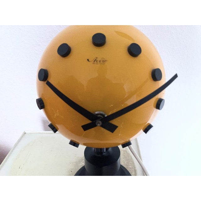 Illuminated table clock from the 70s with cable and plug. The clock and lamp are operated via different circuits. Plastic,...