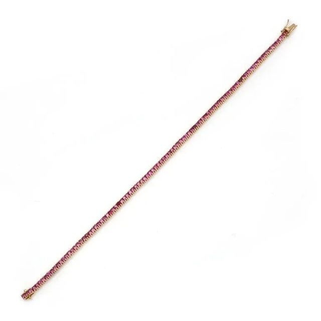 This is part of Chairish’s Fine Jewelry assortment. This Sleek Pink Tourmaline Tennis Bracelet in 14K gold showcases...