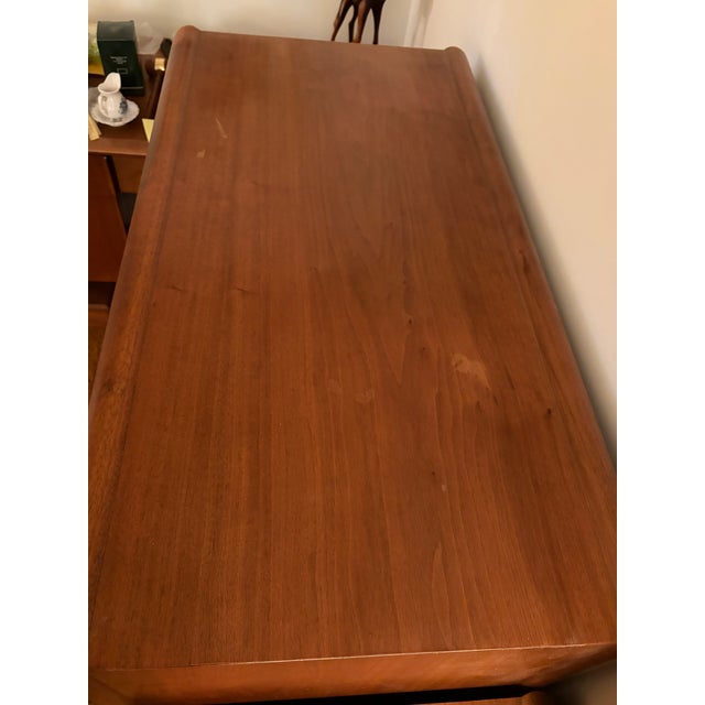 This 1960s Parallel by Drexel walnut highboy has 5 spacious drawers. The top drawer has 2 dividers creating 3 equal...