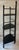 Vintage 3 shelf black wood etagere. Shelves have a nice curved front and acorn shaped detailes at the feet and top.