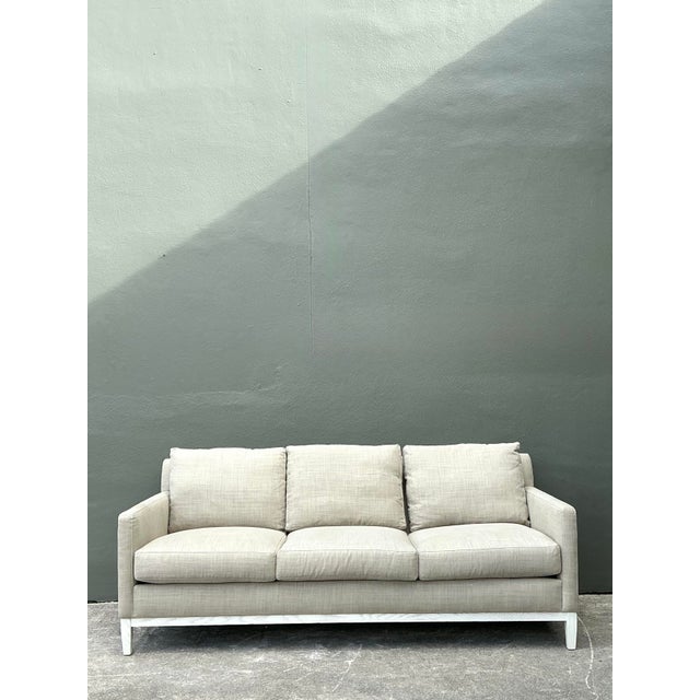 This elegant three-seat sofa by Coley Home exemplifies modern transitional design, blending a clean, architectural...
