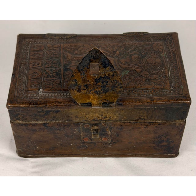 A remarkable antique Indian bronze betel or paan box, of rectangular form with hinged lid and substantial hand-worked...