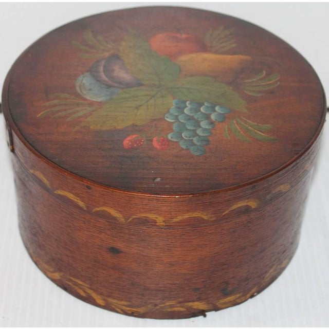This early handmade and painted fruit decorated and swag painted border on lid and base pantry box. The condition or...