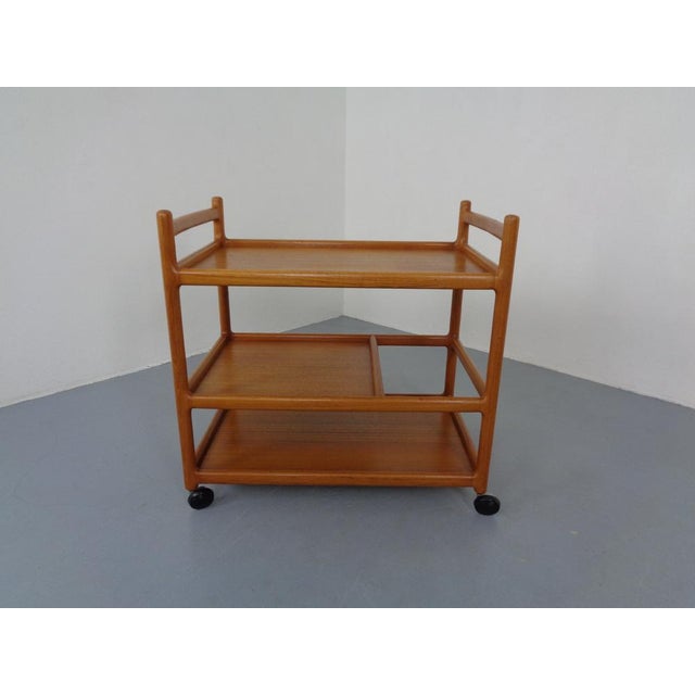 Rollable tea car or serving car in Teak by Johannes Andersen for CFC Silkeborg from the 1960s. This piece has an...
