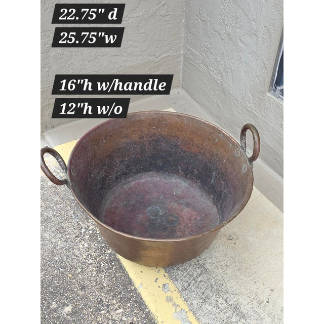 Beautiful old hand hammered copper cauldron with handles. This large heavy copper cauldron is great for decorating with or...