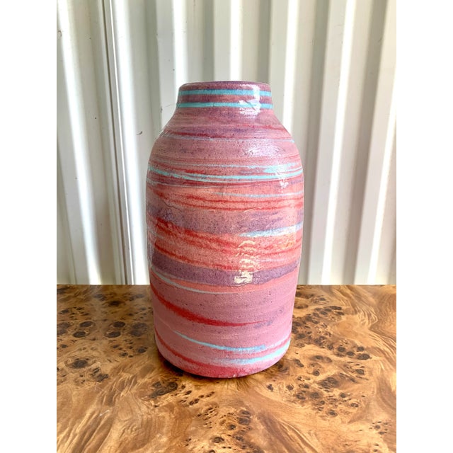 A stunning Pink and Teal glazed vase by renowned ceramicist Dick Studley of Studley pottery. Studley is well represented...