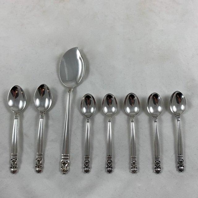 An assembled sterling silver breakfast service, consisting of a server, two jam spoons and five mocha spoons – a set of...