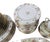 French porcelain partial dinner service by J.P. Limoges, decorated with a polychrome floral vine pattern and gilt trim....