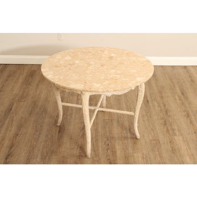 Decorative Round Accent Table Featuring a Beige Marble Top Raised on a Hand Carved Faux Bois Style Wooden Base. The Base...