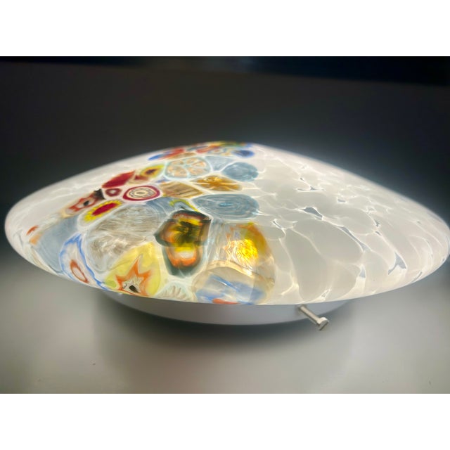 Ceiling light with white feather detailing, featuring a central band of Venetian murrine hand-crafted by master...