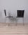 Pair of chairs with chromed metal frame and black leather seat, Italian design, 1990s. I have official proof of...