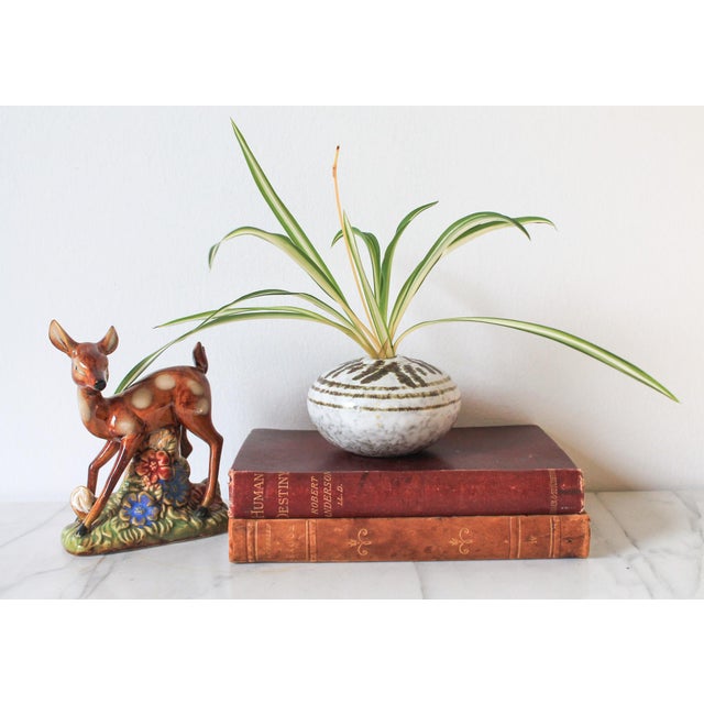 Vintage brown and white studio art pottery bud vase. No maker mark. Minor age wear.