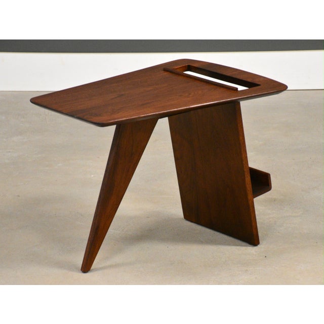 An elusive mid century modern walnut magazine rack end table designed by Jens Risom. Made in USA. Circa 1950’s....