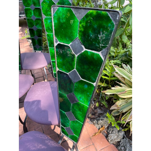 Spectacular set of six mid-century, high back, iron chairs with octagonal tile, inlay, and scrolled iron frame and base....