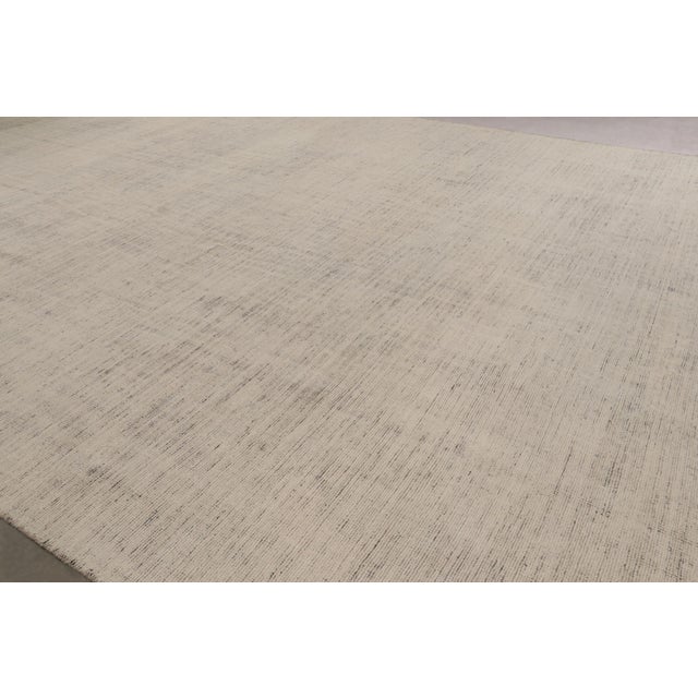 Hand-knotted in wool and cotton, this 11x18 contemporary oversized rug is an exciting new addition to Rug & Kilim’s...