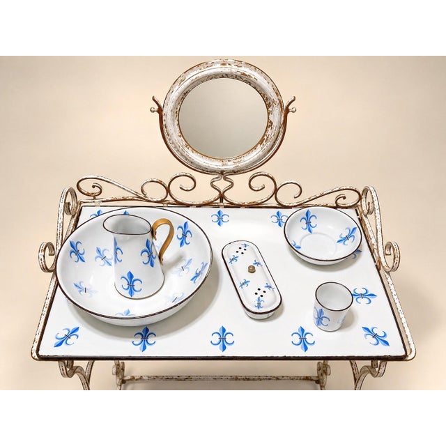 A white lacquered wrought iron dressing table, napoleon iii style, second half of the 19th century, decorated with blue...