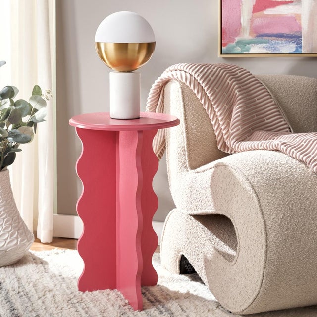Add a touch of artistry and elegance to your home with the Lilith Wavy Accent Table in a stunning rose finish. Featuring a...