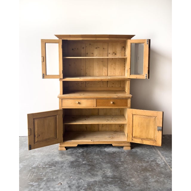 Antique European pine two piece hutch with glass doors up top and storage cabinet below. Two drawers with solid, intact...