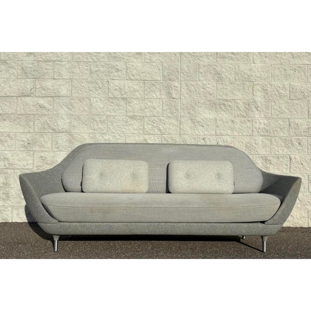 Hard polyurethane with fiberglass reinforced foam envelope an embedded steel frame, resting on four satin-polished legs....