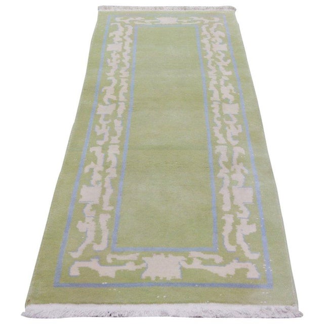 Hand-knotted with care using traditional rug-making techniques, this wool rug blends timeless craftsmanship with a modern...