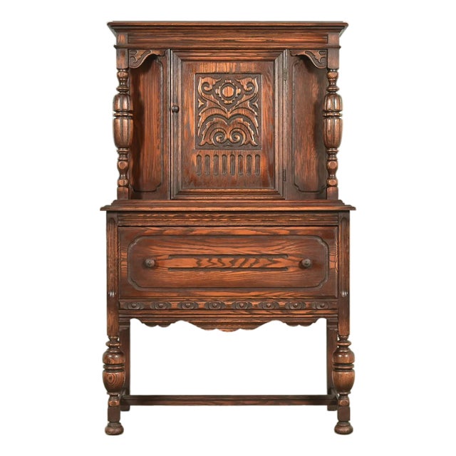 Berkey & Gay Style Antique English Jacobean Carved Oak Bar Cabinet, Circa 1920s For Sale