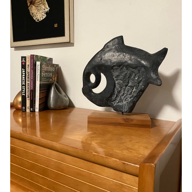 A quintessential piece of 1970s organic modernism, this 13-inch abstract fish was created by Austin Productions and likely...