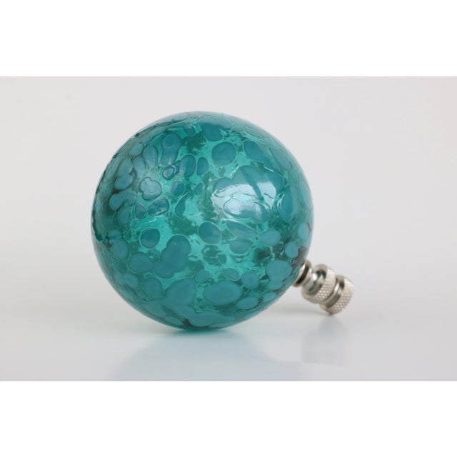 Lamp finial crafted from a large glass bubble in teal topping a knurled chrome swivel base. Handmade in the USA & fixed...