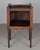 A 19th century Country French side table or nightstand made of solid walnut, with pierced heart shaped cut-outs on the...