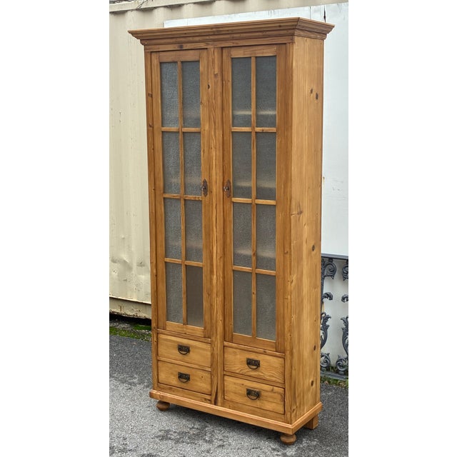 This is an unusual piece. Not odd, but it is rare for us to come across a cupboard that combines such a narrow width with...