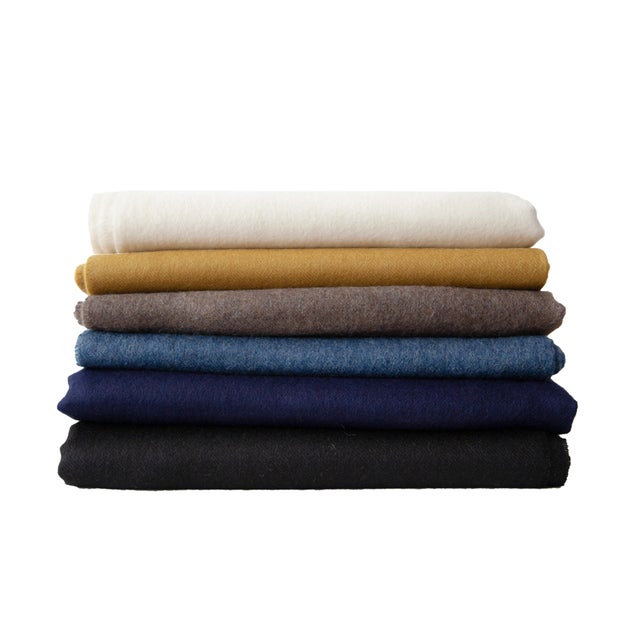 DESCRIPTION Luxuriously soft wrap / throw blanket loomed from 100% baby alpaca for the softest, year-round, warmth....