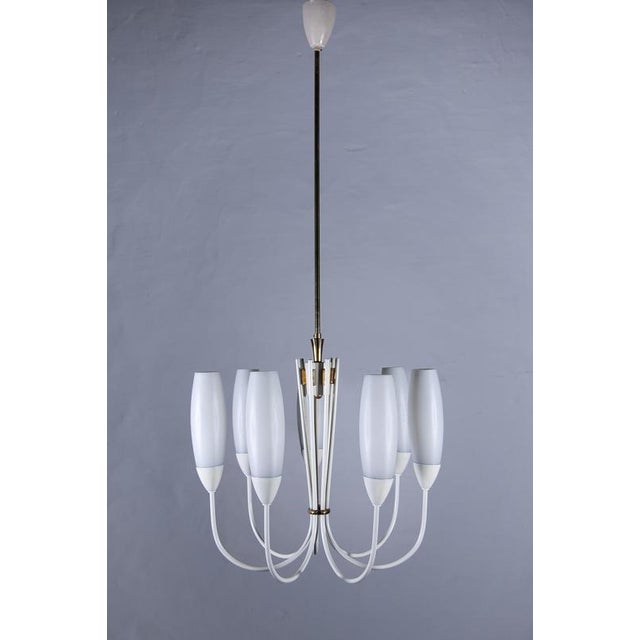 Beautiful vintage fifties chandelier designed in Germany, a six-arm chandelier with six white opaline glass shades. The...