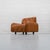 Rare Italian armchair by Bonacina from the 1970s, featuring a soft, enveloping shape and upholstered in cognac-colored...