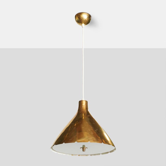 Description Brass Pendant by Paavo Tynell A large edition of the K2-46 chandelier by Paavo Tynell for Idman. The brass...