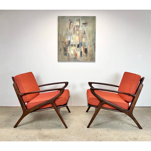 A pair of circa 1960’s Danish Modern style lounge chairs evocative of the Z Chair designed by Poul Jensen for Selig. These...