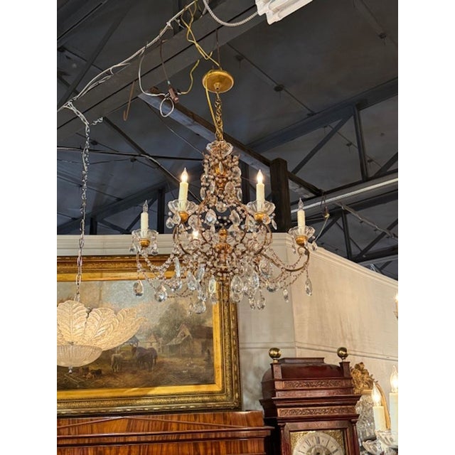 Beautiful traditional antique Italian beaded and crystal chandelier with tole giltwood. Makes an elegant statement. Circa...