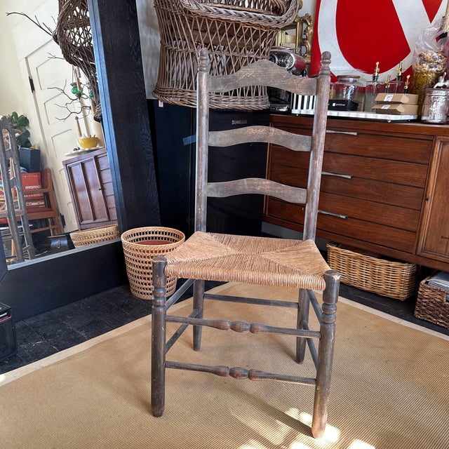 Antique French and American style woven ladder back chair. Woven seat cushion is in good condition. Some wear and patina...