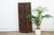 From the Nupe people of central Nigeria's Niger River region, this striking door is built from three narrow vertical...