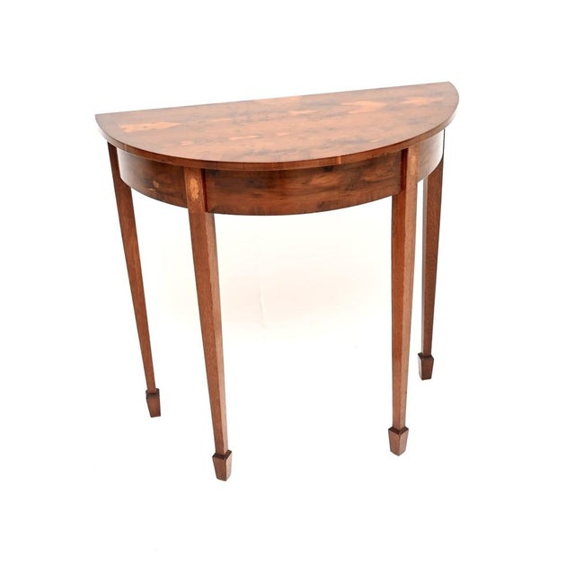 A wonderful antique inlaid yew wood console table in the Sheraton revival style. This was made in England, it dates from...