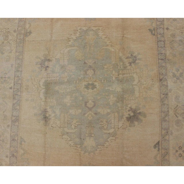 Cream Oushak Vintage Turkish Rug With Faded Central Medallion Design in Cream Colors For Sale - Image 8 of 13