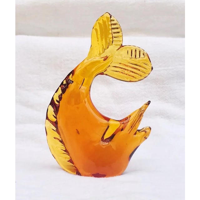 Beautifully made 1960's Italian amber glass fish figurine. It looks like a sailfish or swordfish with its upturned tail...