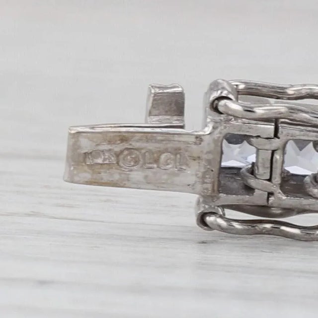 Gemstone Information: - Lab Created Sapphires - Total Carats - 11.50ctw Cut - Princess Brilliant Color - Dark to light...