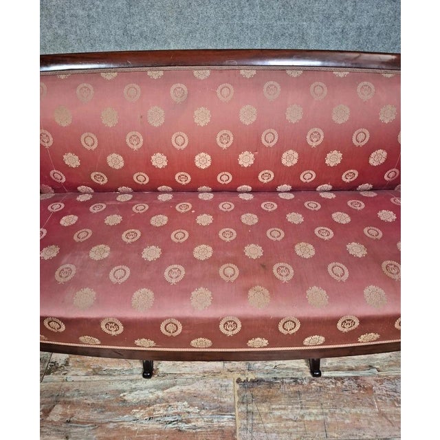 An elegant Restoration/Empire style sofa, resting on a finely crafted solid wood frame. The scrolled armrests and cabriole...