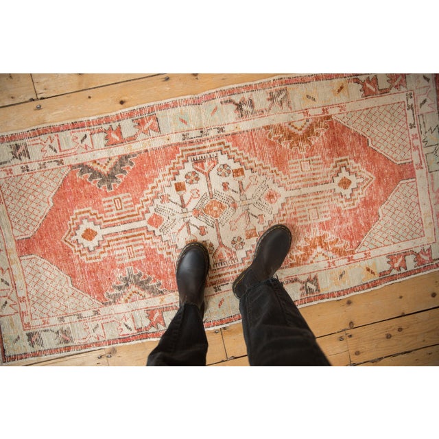 :: Stepped center medallion with interior geometric floral blossoms outwardly directed. Long stemmed finials in simplistic...