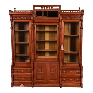Herter Brothers Style Antique Eastlake Victorian Carved Walnut Triple Bookcase Cabinet, Circa 1880s For Sale