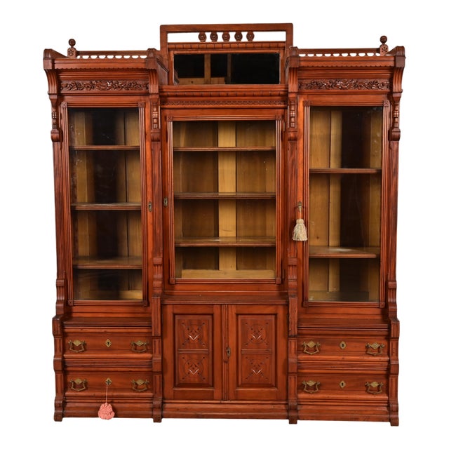 Herter Brothers Style Antique Eastlake Victorian Carved Walnut Triple Bookcase Cabinet, Circa 1880s For Sale