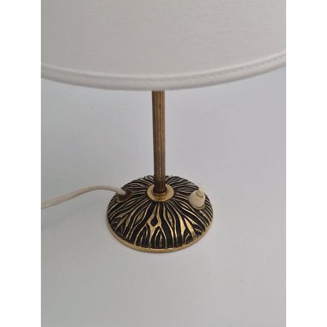 A swedish modernist table lamp in solid brass designed by bo råman / sonja katzin, 1950s. Produced by asea, sweden. A...