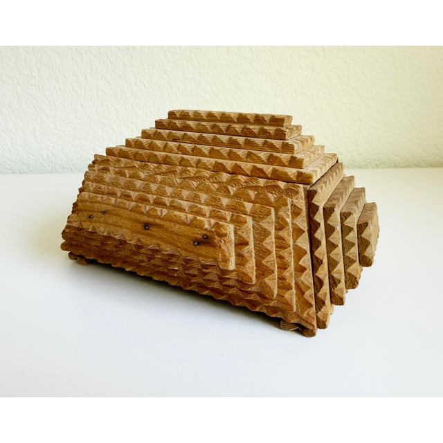 This wonderful American folk art box, an example of early 20th-century tramp art, includes a large-scale chip-carved,...