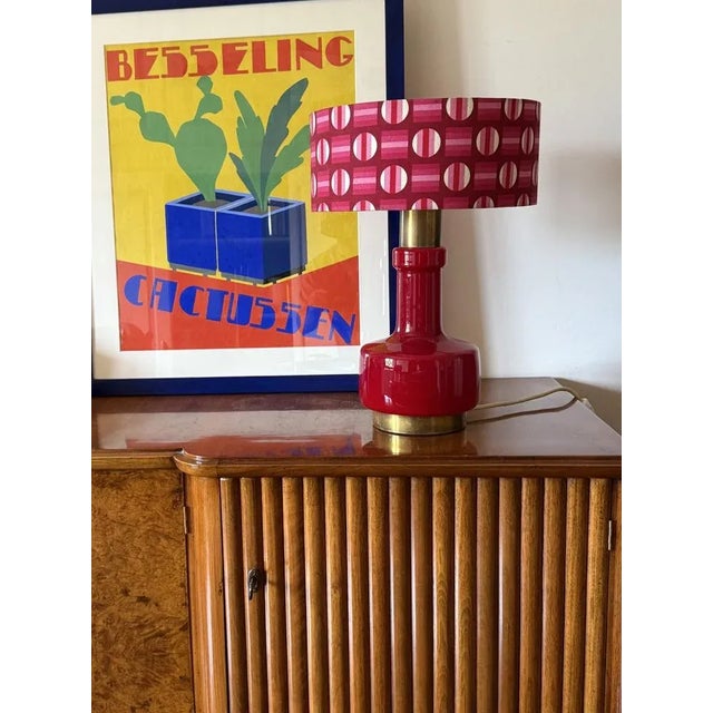 Space Age red table lamp attributed to Stilnovo, Italy 1960s Red glass, brass. Space age fabric lampshade included Double...