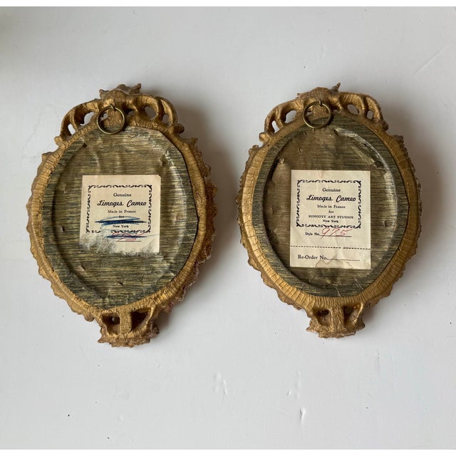 Pair of mid-century framed cameo plaques featuring a raised relief of classical Roman goddess figures. Round metal hanger...
