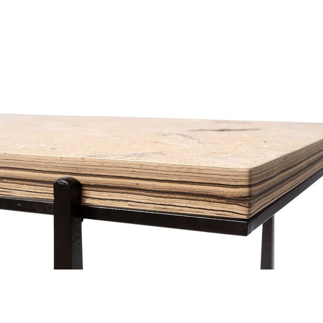 A small fossil console table with a 10" x 34" stone top with a brushed finish. The fossils include a 5-1/4" Cockerellites...